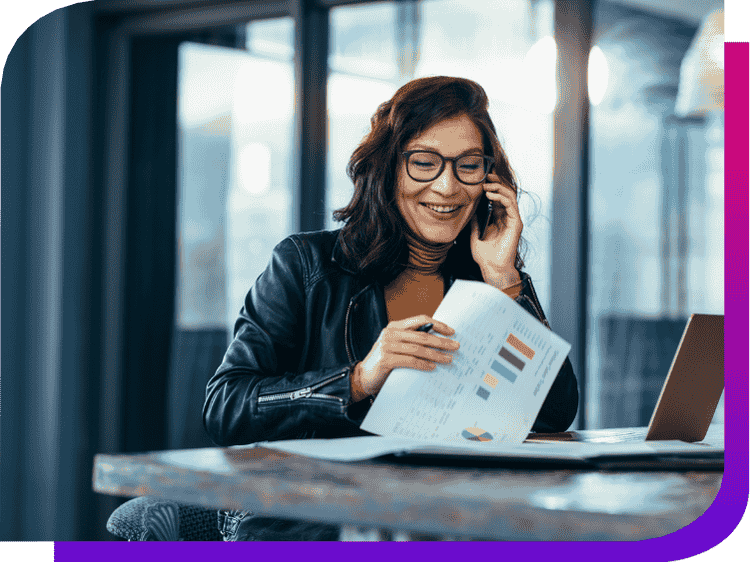 a woman on the phone holding a report